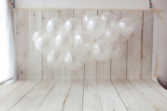 Balloon garland on wooden background. Birthday party photo zone.