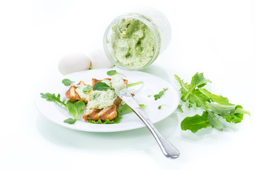 green bread spread of arugula, curds and eggs with fried toast