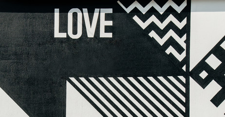 Black and white graffiti love signs painted on a wall