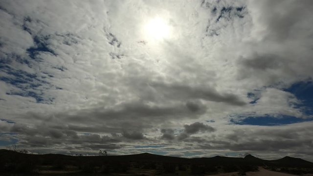 time lapse clouds over the mountains in the mojave desert