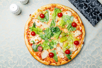 Pizza Caesar with chicken and tomatoes