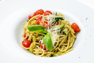 Spaghetti with vegetables with pesto sauce