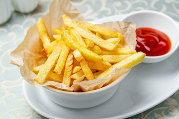 french fries on plate with ketchup