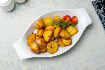 baked mini potatoes on white plate