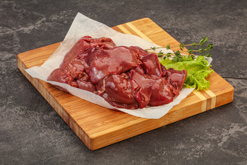 Raw chicken liver over board