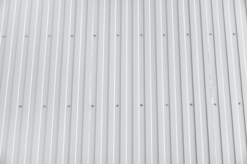 Obraz premium white metal siding on a wall as background