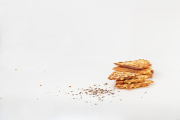 Waffle cookies and seeds isolated on a white background.