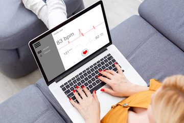 Woman Using Laptop - diagnosis and treatment on a laptop online