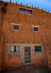 Colorful windows and door of old mission home