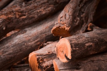 Stack of logs for firewood. Rustic, countryside lifestyle background.