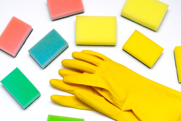 yellow rubber gloves and washcloths on a white background