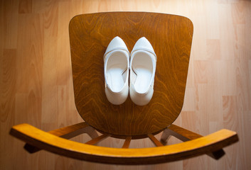Shoes on an old wooden chair