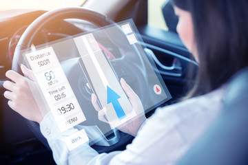 Young woman using navigator application smart phone on smart phone to point the direcetion while...