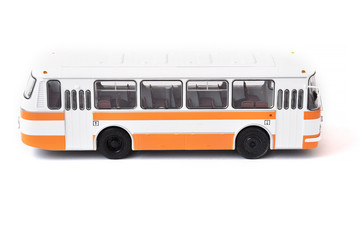 Scale model of a white yellow Russian bus. Toy yellow bus