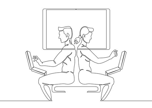 a girl and a guy are sitting at laptops