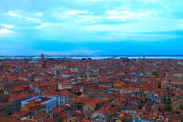 Fototapeta na wymiar Cityscape of Venice. Roofs of the old city from a height. Venice from above. Sunset in Venice. Italy