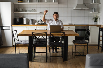 Young freelancer have a great idea working from home. Excited glad young freelancer catch an idea....