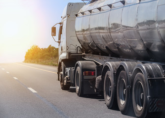 Obraz na płótnie Canvas Fuel truck moving along a country road