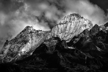 a beautiful mountain view with fog and clouds
