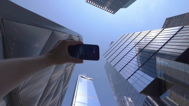 POV on Tourist Photographing Skyscrapers in Financial District in NYC in 4K Slow motion 60fps
