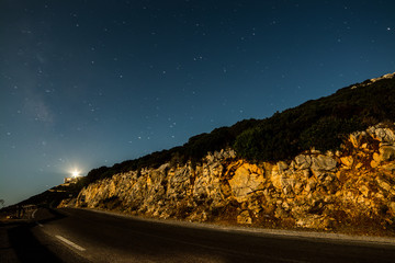 Fototapeta na wymiar Starry sky over a country road in Sardinia