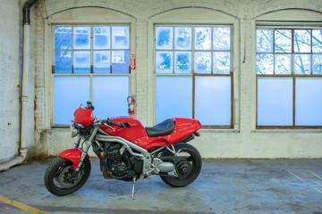 red racing motorcycle in garage