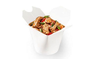 Delicious beef teriyaki wok noodles with fresh spring onion, sesame seeds and red bell pepper. Perfect for delivery and branding space for text available. Plain white food container delivery takeaway.