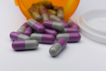 Pills spilling out of pill bottle