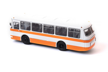 Scale model of a white yellow Russian bus. Toy yellow bus