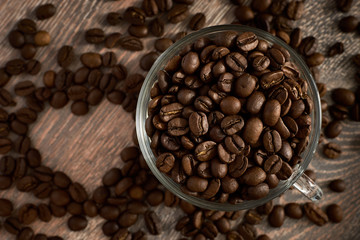 glass cup full of coffee beans with a heart