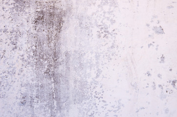 The texture of the old concrete wall with scratches, cracks, dust, crevices, rou