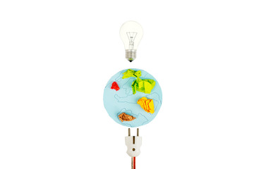Earth map with electric plug and light bulb