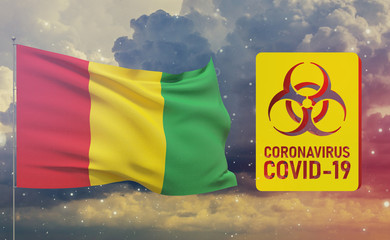 COVID-19 Visual concept - Coronavirus COVID-19 biohazard sign with flag of Guinea. Pandemic 3D illustration.