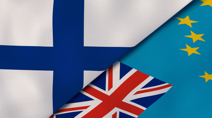 The flags of Finland and Tuvalu. News, reportage, business background. 3d illustration