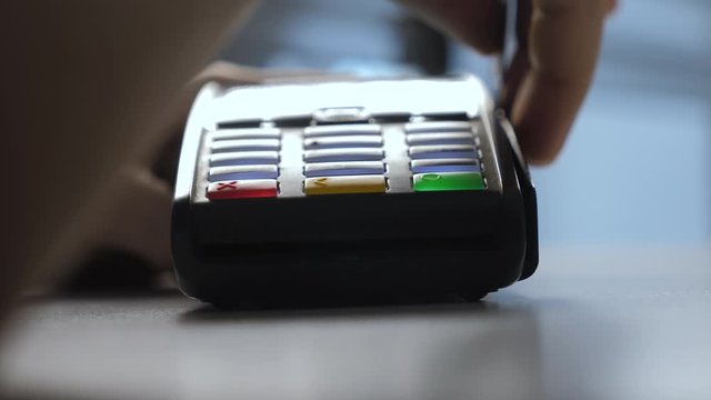 Payment by credit card lifestyle , purchase and sale of goods and services. Credit card in the store. girl pays on the card reader online shopping concept