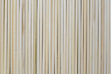 Obraz premium Set of vertical natural wooden sticks, background.