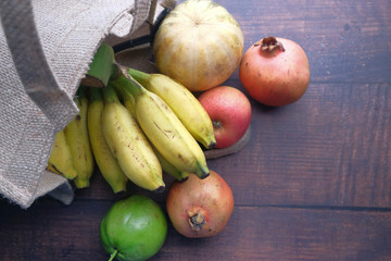 Shopping bag full of fresh vegetables and fruits.