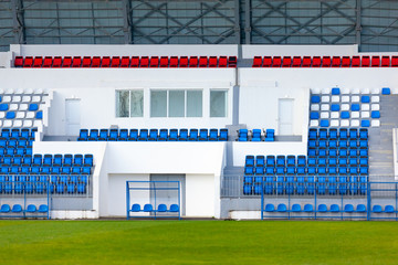 blue and white rows of seats on the stadium