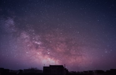 Fototapeta premium starry night sky over city
