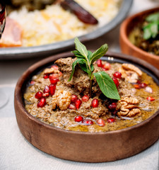 boiled meat with pomegranate and walnuts