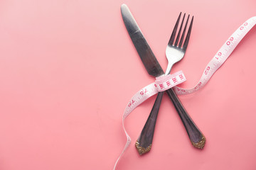 fork, knife and measuring tape. Diet concept