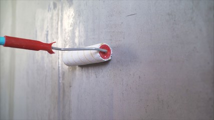 Primer concrete wall. Priming the wall. concrete wall.