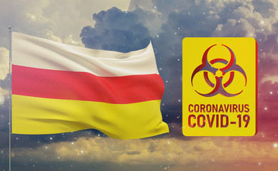 COVID-19 Visual concept - Coronavirus COVID-19 biohazard sign with flag of South Ossetia. Pandemic 3D illustration.