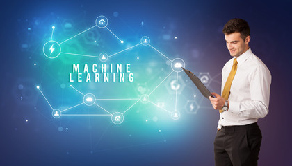 Businessman in front of cloud service icons with MACHINE LEARNING inscription, modern technology concept