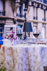 Blueish decoration with wine, artificial flower and lamp
