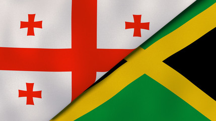 The flags of Georgia and Jamaica. News, reportage, business background. 3d illustration