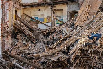 View of construction waste, concrete debris with reinforcement and pieces of metal,  after the...