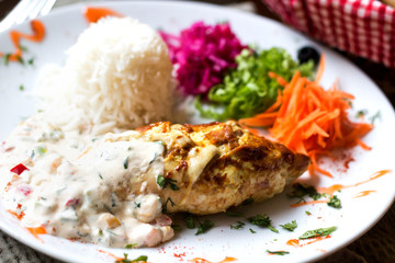 chicken cutlet in sauce with rice