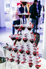 Champagne glasses pyramid with cherry