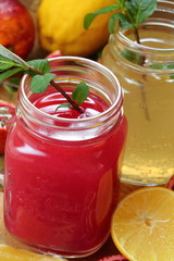 Fresh lemon and orange juice with mint in glasses
